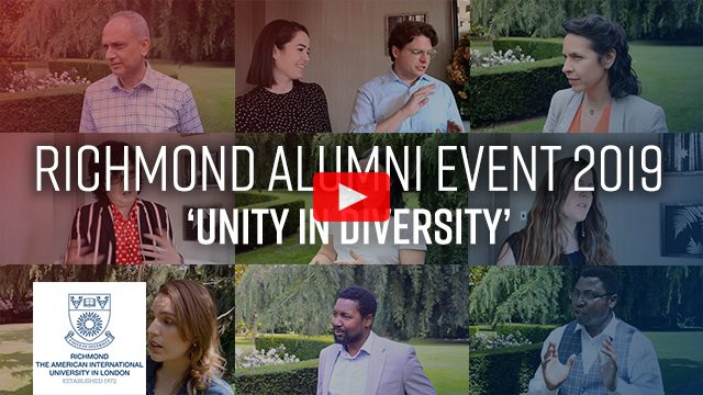 A smiling person and person stand outdoors at the Richmond Alumni Event 2019, celebrating 'Unity in Diversity' at the American International University in London, established in 1972.
