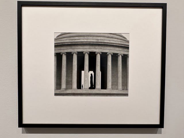 The black and white photo displays a building with columns.